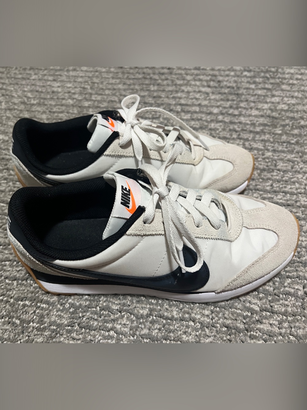 Nike Men’s White Sneakers with Black Swoosh and Orange Logo